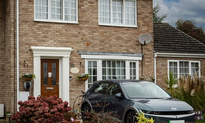 beige brick house solar panels.jpg
